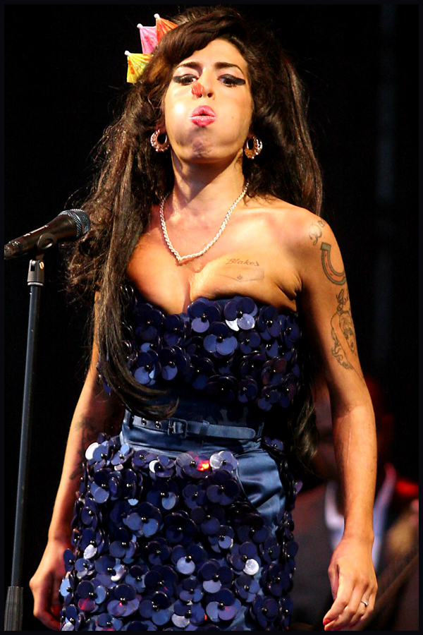 Troubled singer Amy Winehouse appears on The Pyramid stage at the 2008 Glastonbury Festival.