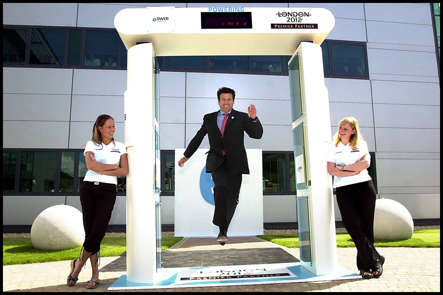 Lord Seb Coe leaps throught the EDF Energy Leap counter in support of the 2012 London Olympic bid watched by Sophie Graham (Left) & Jenny Harris at the EDF Energy HQ, Exeter, Devon. CLIENT: EDF Energy