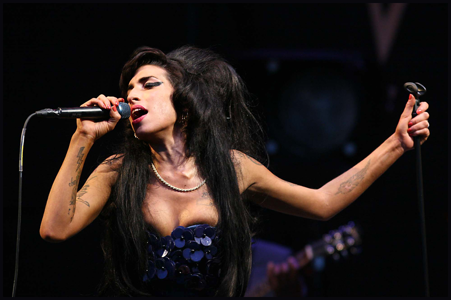 Troubled singer Amy Winehouse appears on The Pyramid stage at the 2008 Glastonbury Festival.